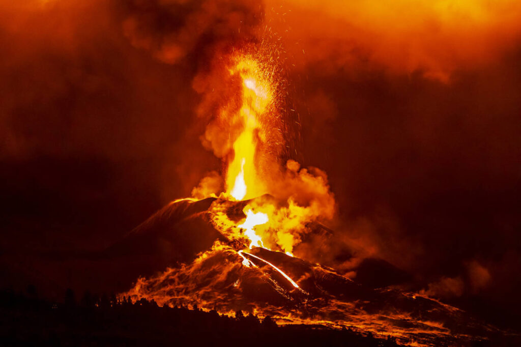 erupting volcano, cumbre vieja, la palma at night in december